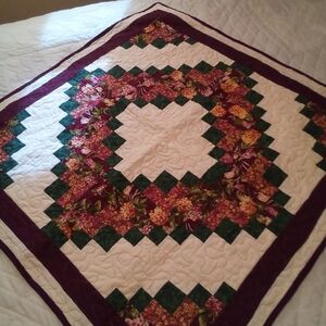 Handmade Floral Quilt with Green and Purple Accents